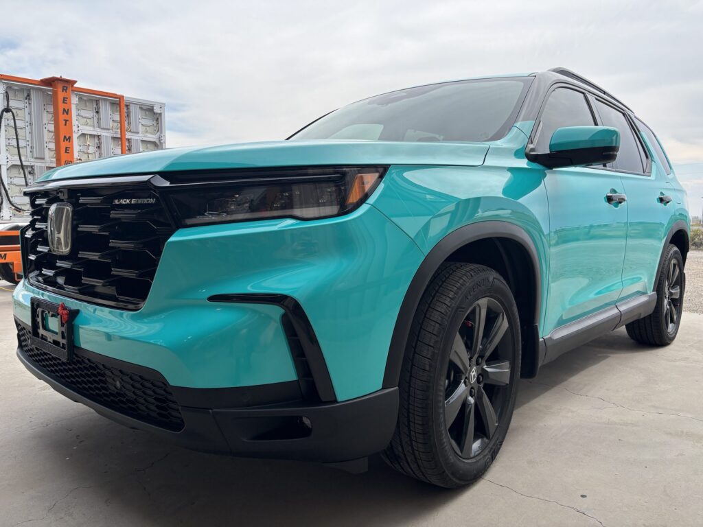 Teal color-change wrap on a Honda Pilot Black Edition