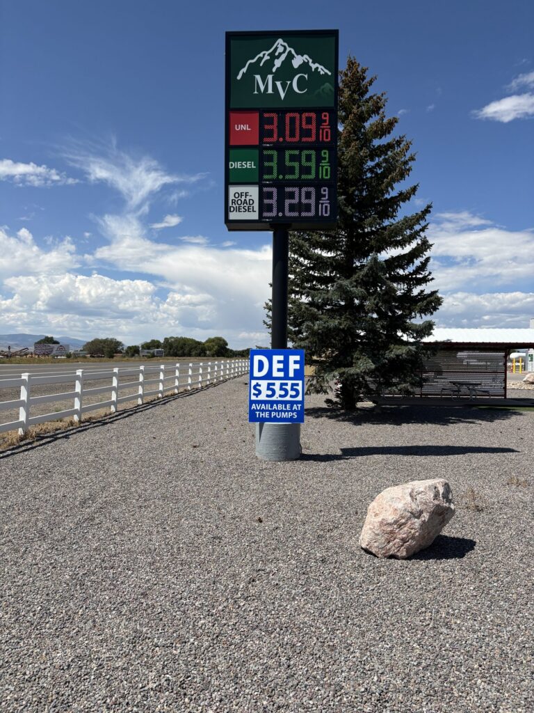 Monte Vista Co-op (MVC) pylon sign with LED fuel price displays and a DEF price sign